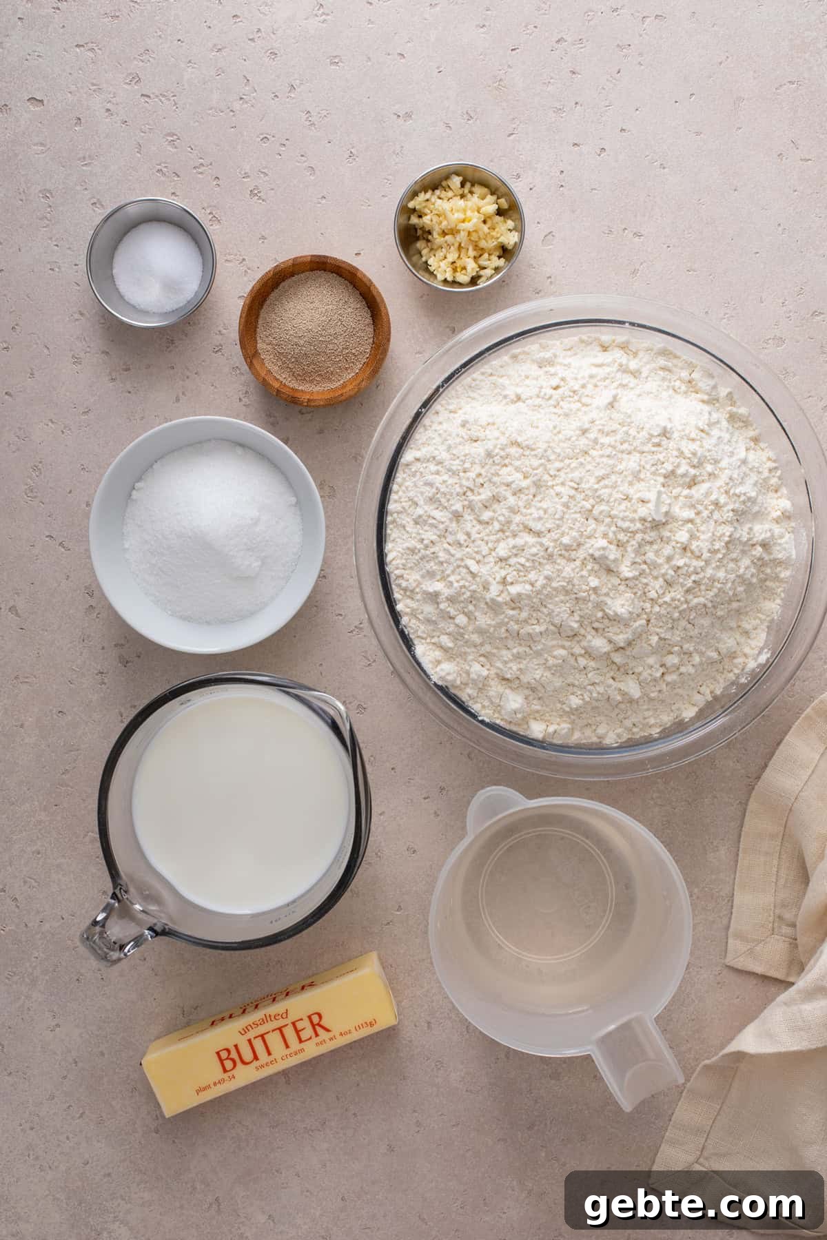 Ingredients for brown and serve rolls arranged on a countertop.