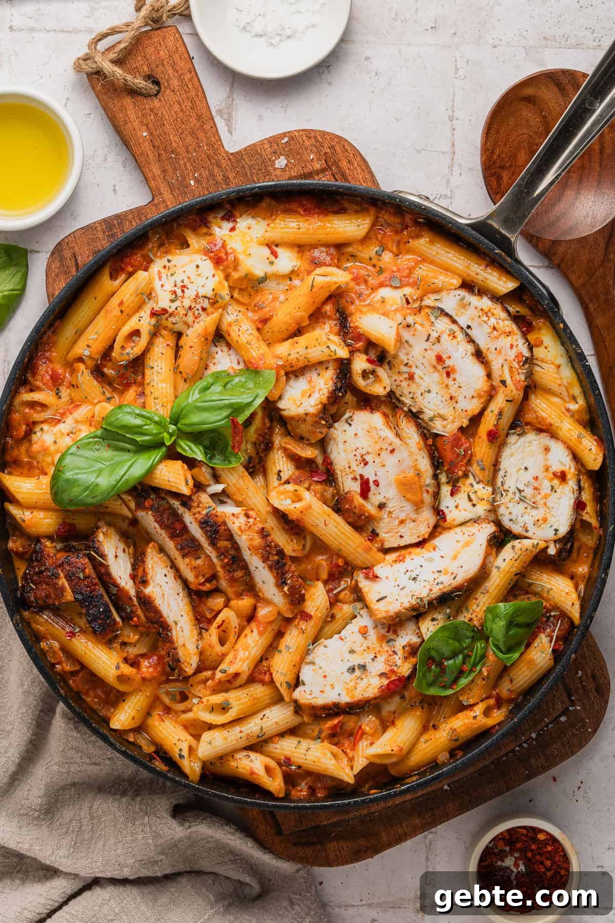 Creamy Vodka Penne with Grilled Chicken and Parmesan 2 The completed penne alla vodka with chicken recipe completed in the skillet.