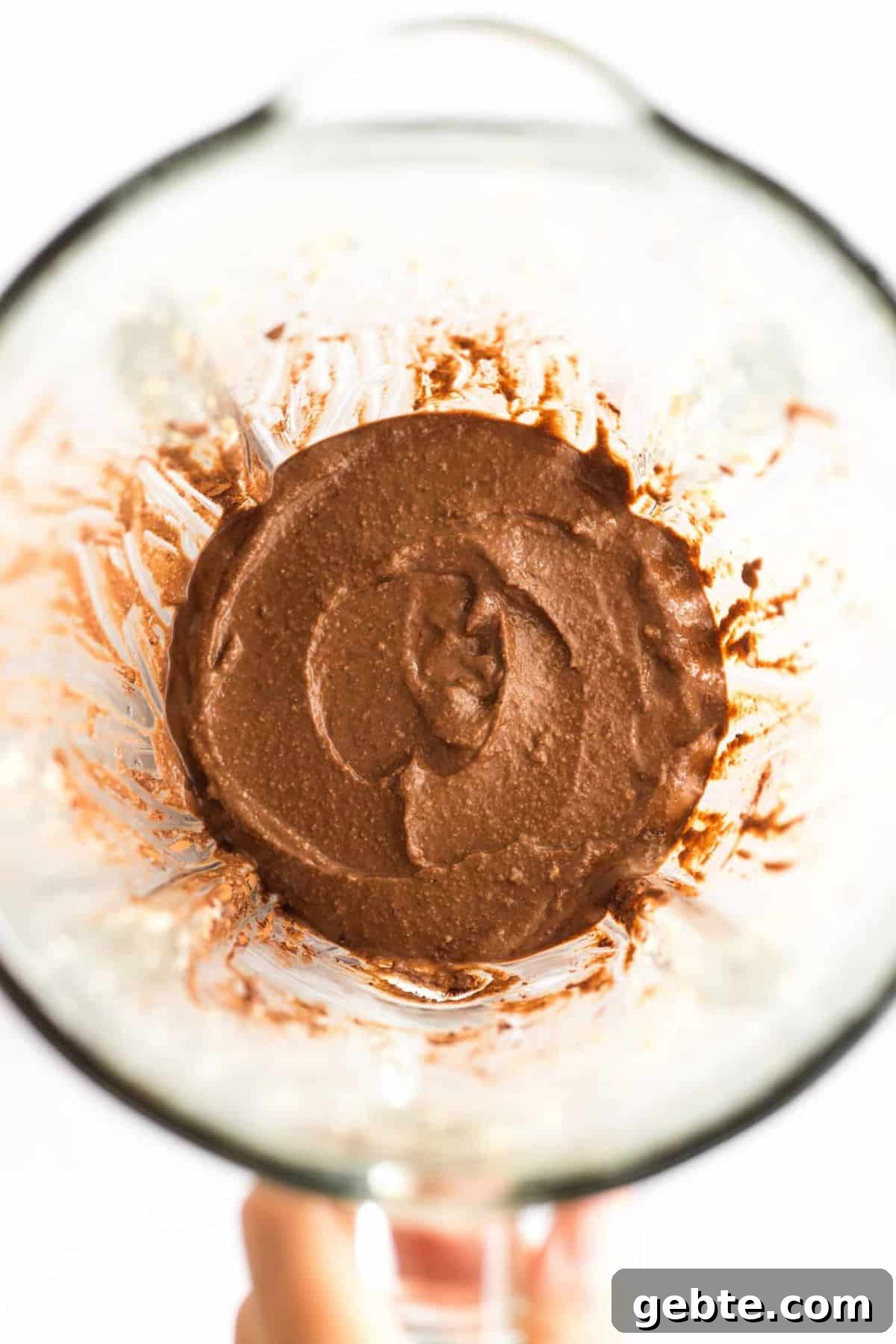 Gluten-Free Chocolate Pudding (Vegan) Gluten-free chocolate pudding in bowl of high-speed blender.
