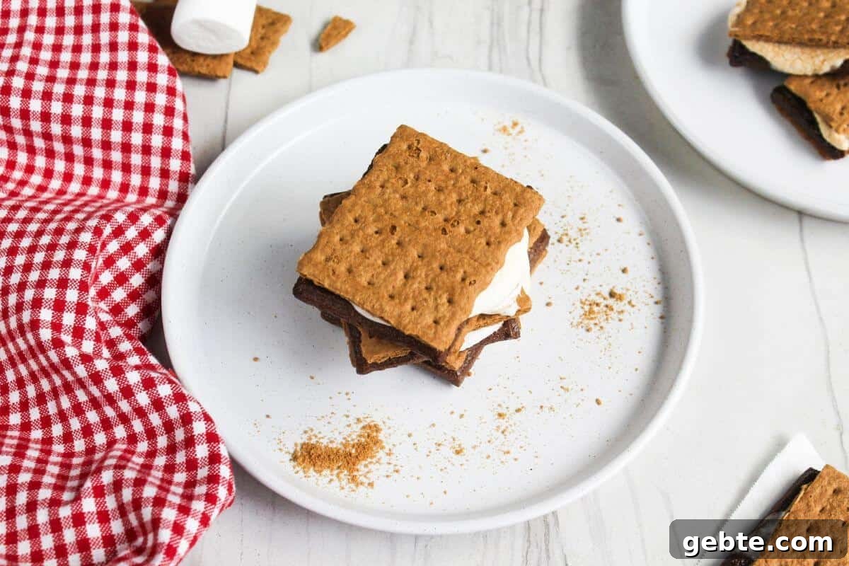 Crispy Air Fryer S'mores Recipe: Gooey Campfire Treats Fast 2 A stack of s'mores on a plate.