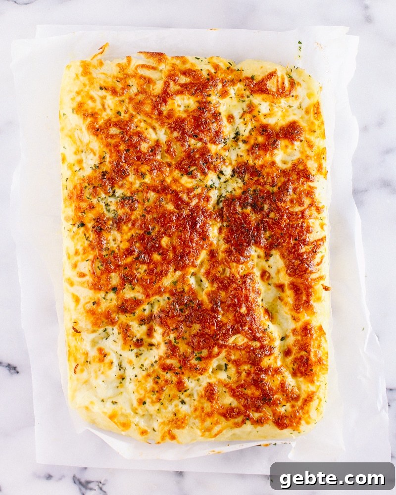 Cheesy garlic bread in pan