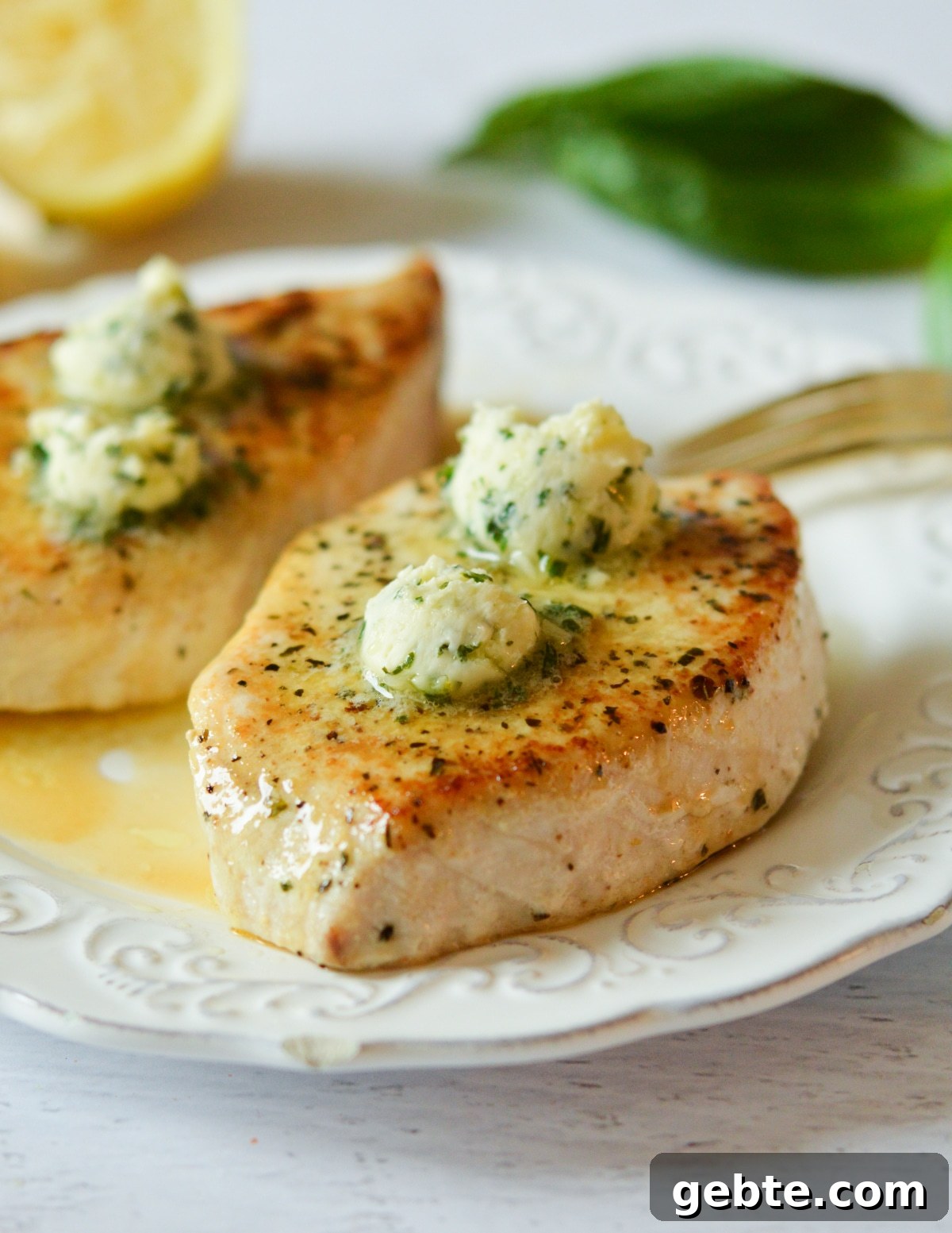 Lemon Basil Butter Baked Swordfish with Garlic and Herbs 2 swordfish steaks with lemon basil butter.