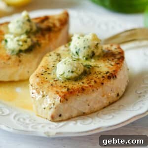 Lemon Basil Butter Baked Swordfish with Garlic and Herbs 9 swordfish with lemon basil butter on it.