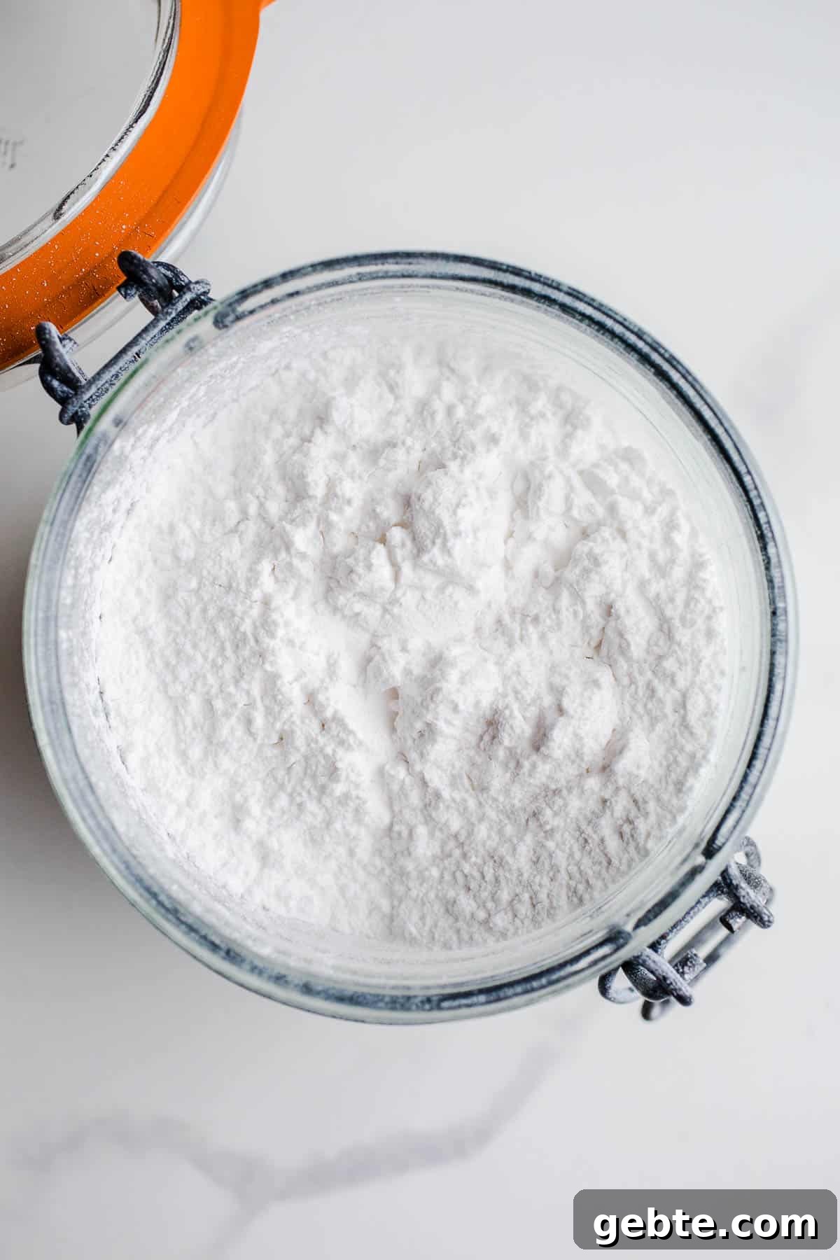 Is Arrowroot Safe for a Gluten-Free Diet? 3 A glass mason jar filled with arrowroot starch.