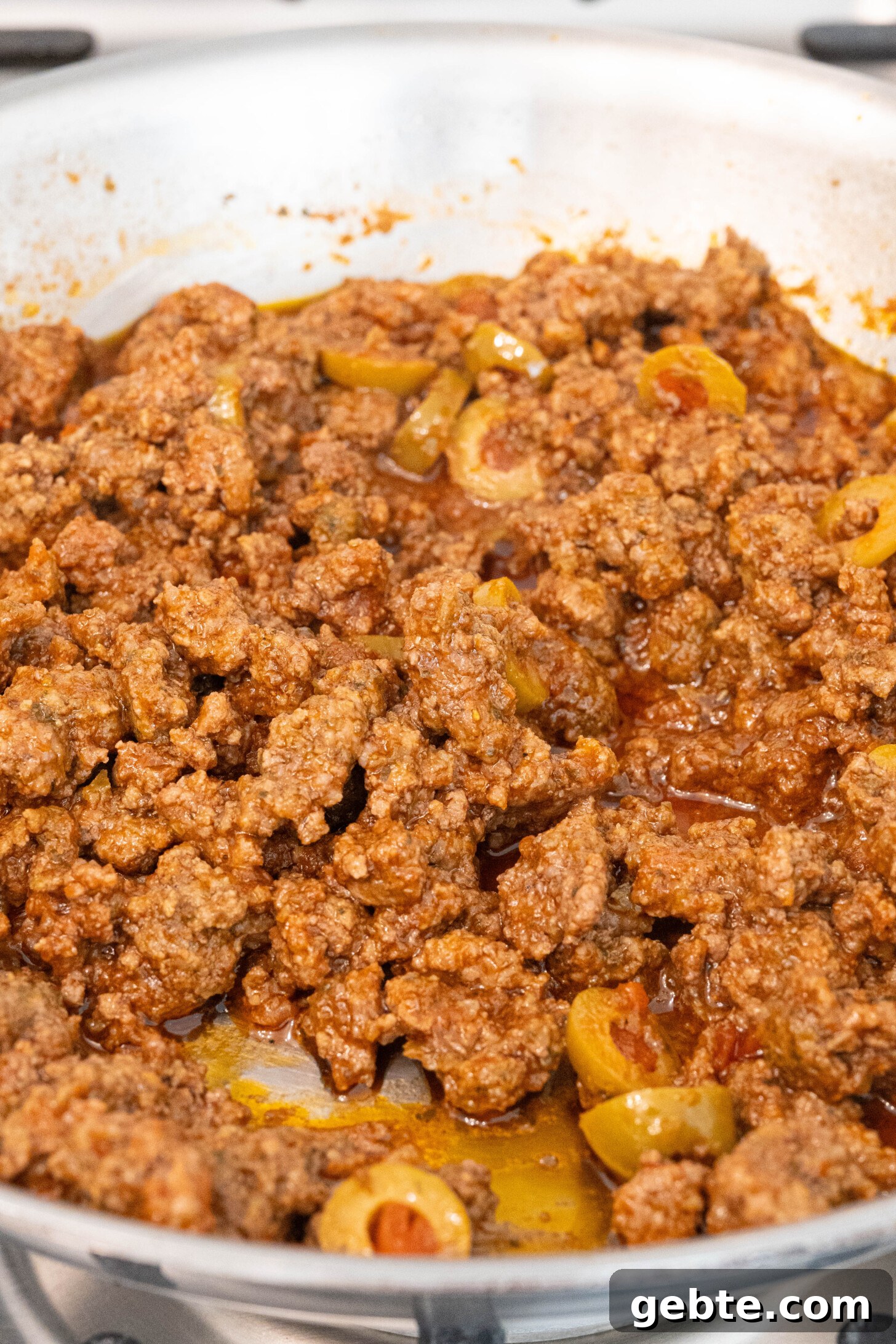 Authentic Puerto Rican Piononos: Savory Plantain Cups Recipe 4 a pan of picadillo