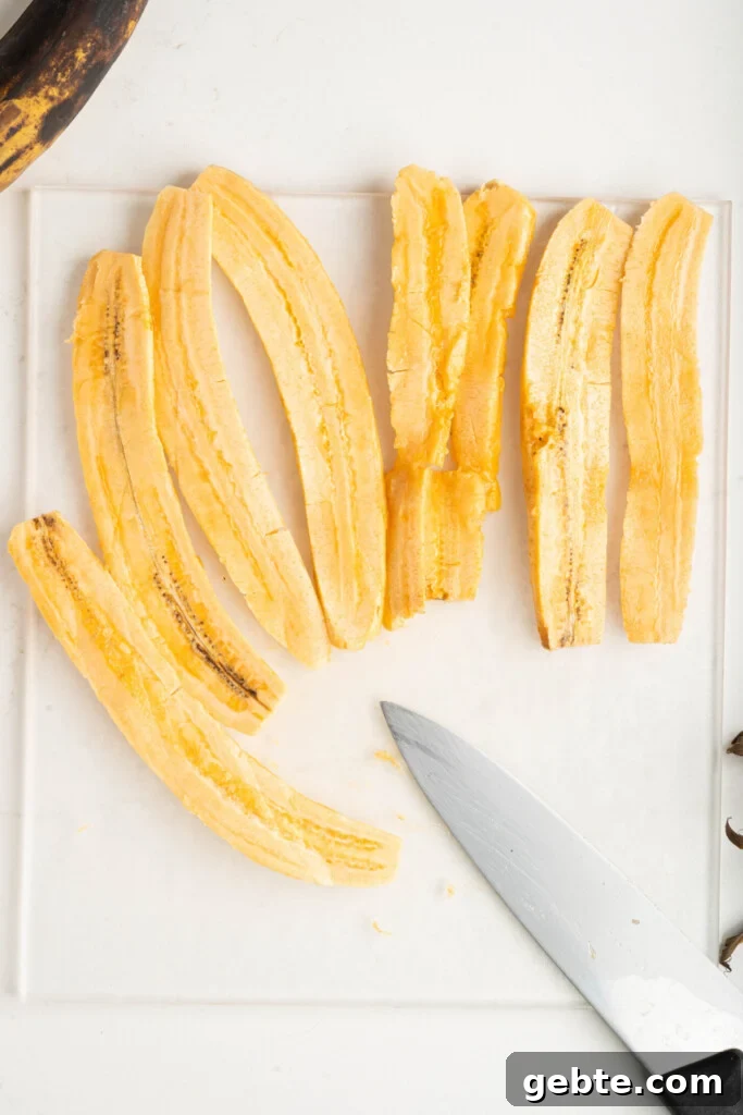 Authentic Puerto Rican Piononos: Savory Plantain Cups Recipe 5 sliced plantains on a cutting board