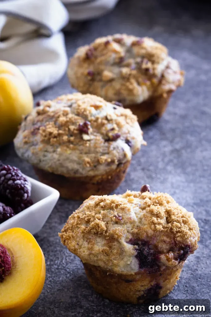 blackberry peach muffins with a coffee cake streusel