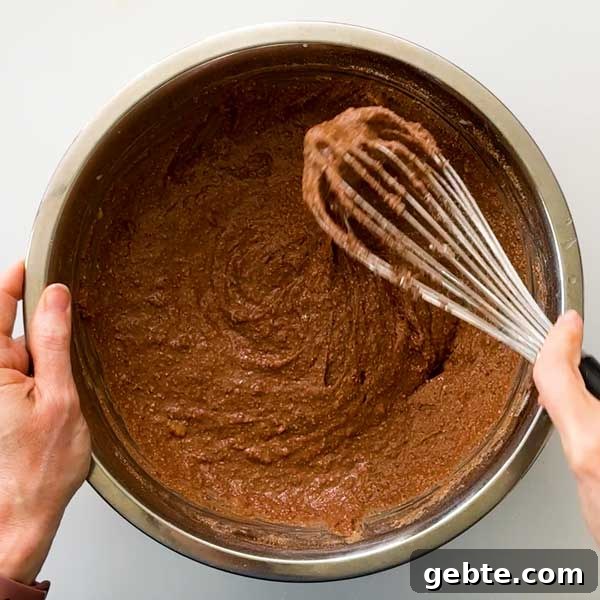Chocolate Banana Protein Muffins with Oat Flour Recipe 5 Whisking the chocolate muffin batter.