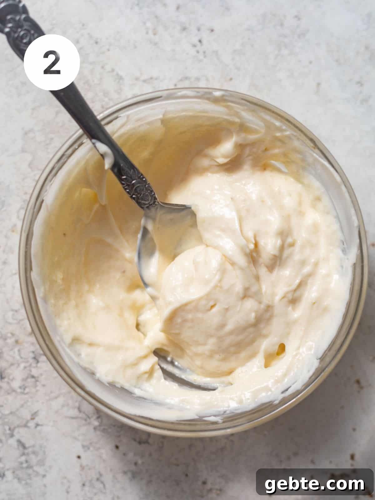 mayo and garlic paste mixed together in a small bowl to create the garlic mayo sauce.