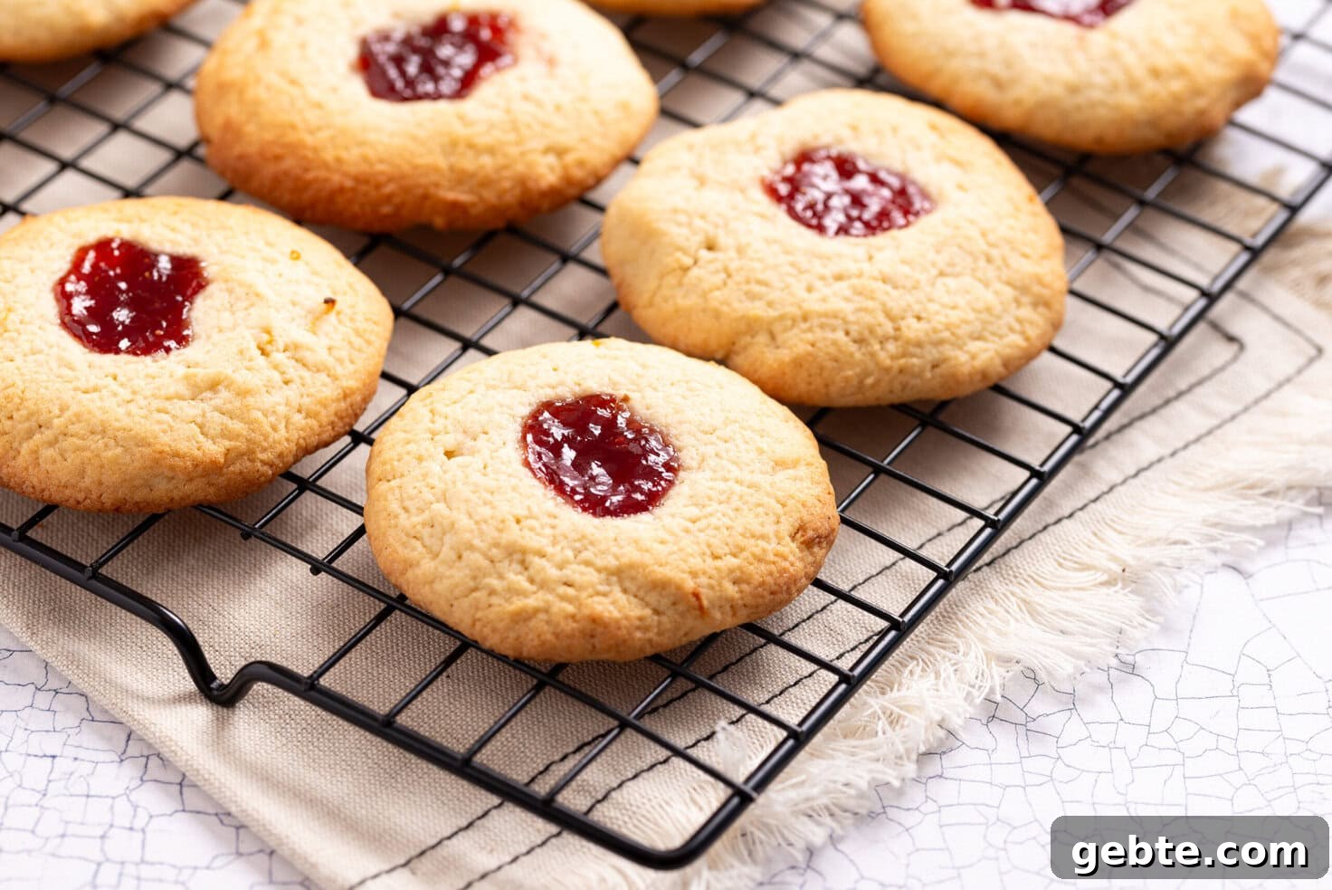 An image of strawberry lemonade cookies on a wire rack.