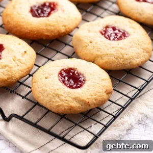 An image of strawberry lemonade cookies on a wire rack.