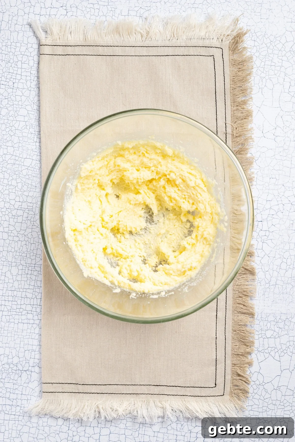 An image of butter and caster sugar combined in a bowl.