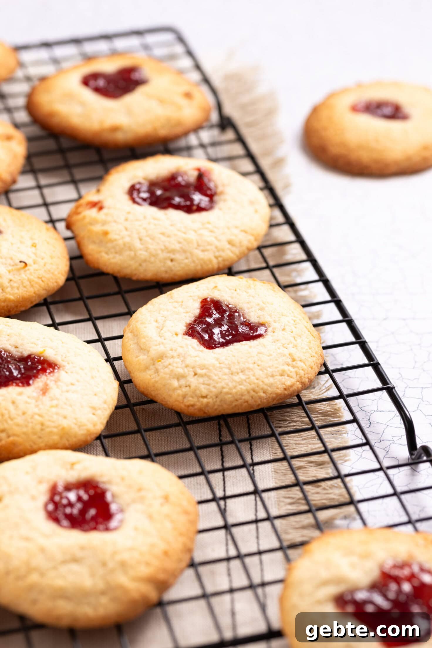 An image of strawberry lemonade cookies on a wire rack.