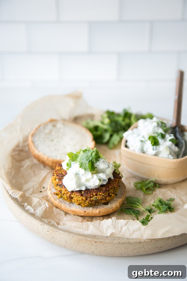 red lentil veggie burgers with mint raita on a plate