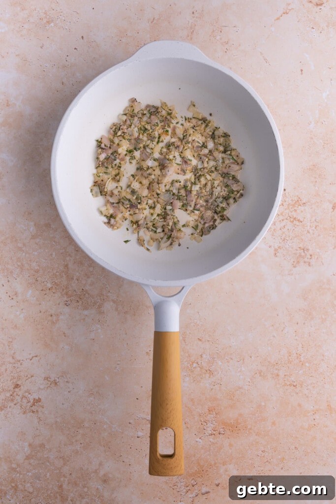 Cooking down shallots, garlic, and rosemary.