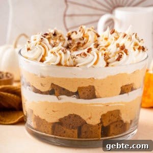 Garnished pumpkin trifle in a trifle dish.