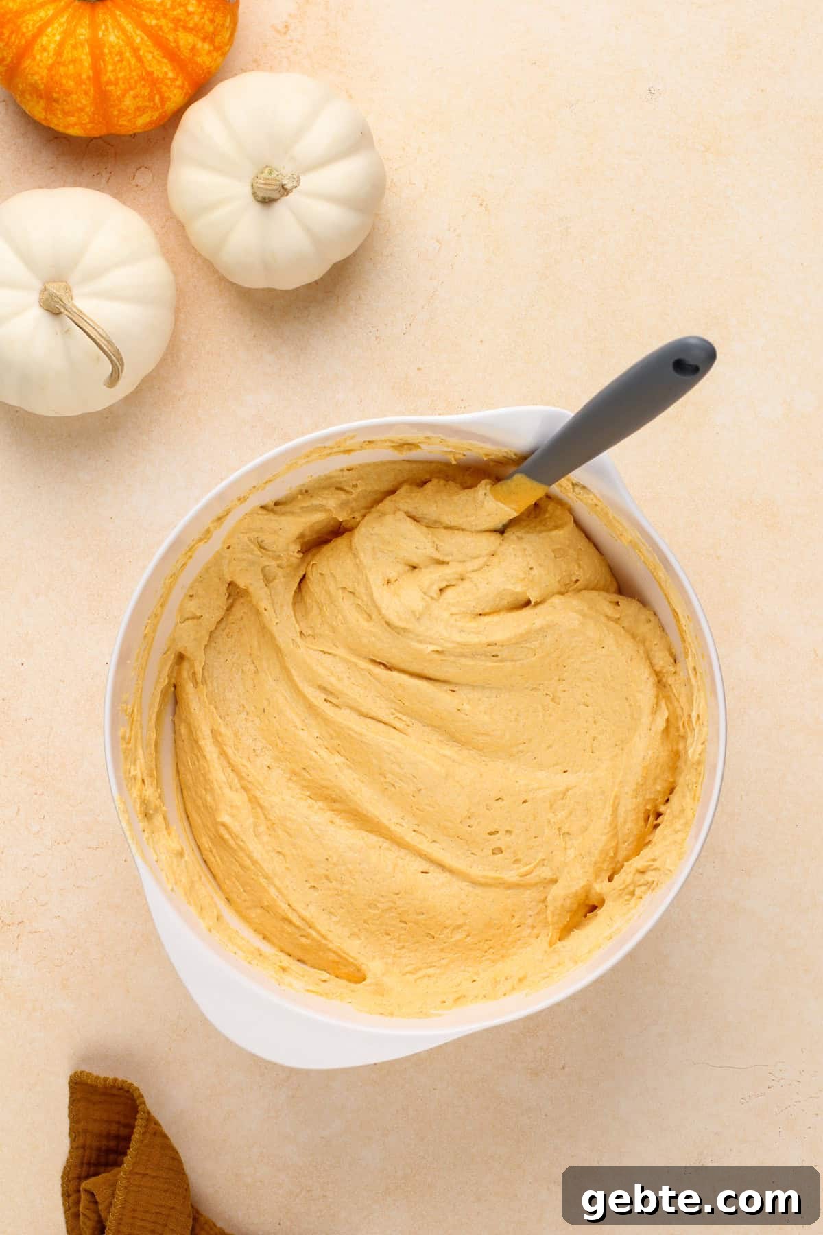 Cool whip folded into pumpkin cream cheese filling.