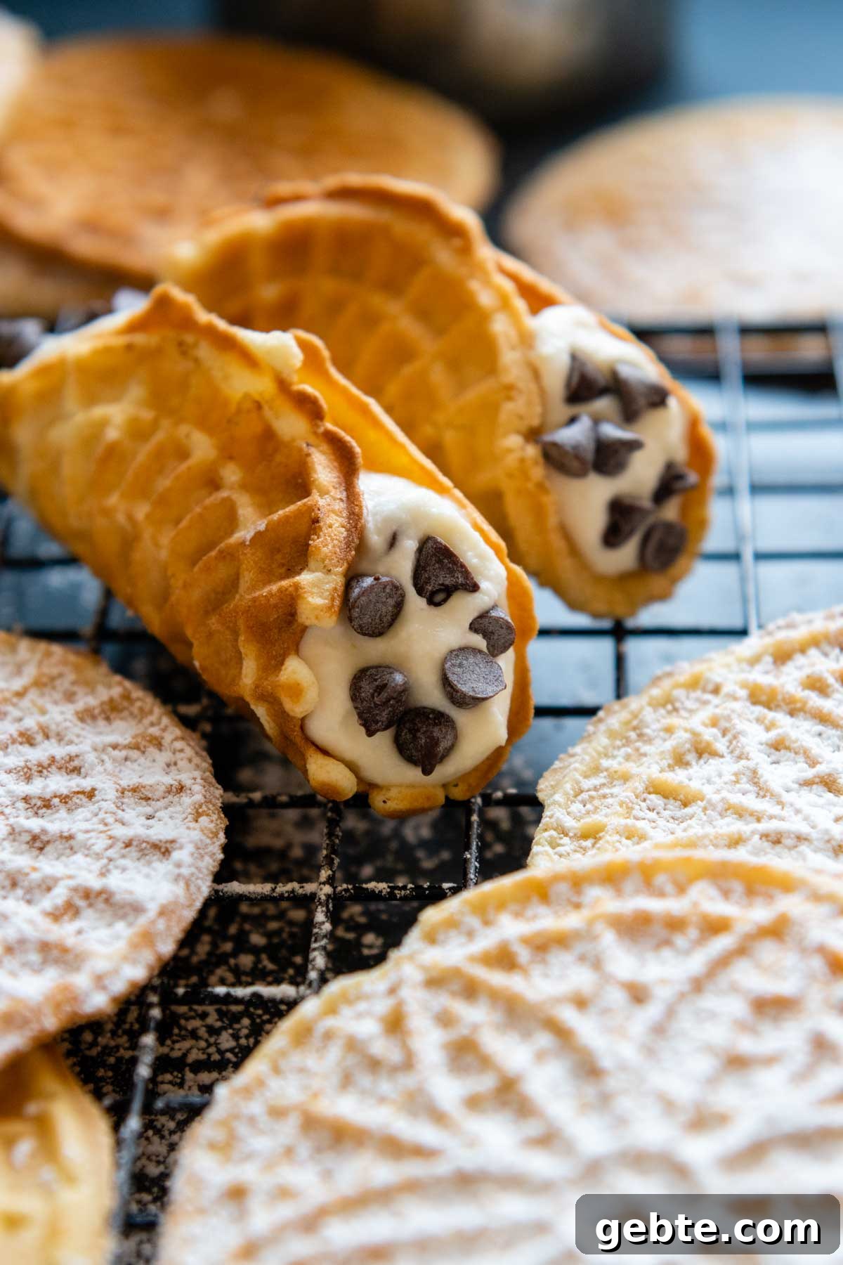 Crisp Gluten-Free Pizzelle Recipe: Authentic Italian Cookies 6 image of pizzelles shaped into cannoli shells