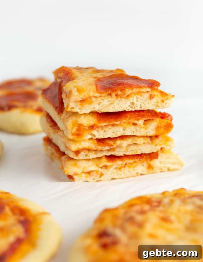 stack of sliced mini pepperoni pizzas