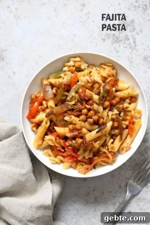 Vegan Fajita Pasta with Chickpeas and veggies. Easy Weeknight pasta with Taco seasoned veggies and beans mixed with creamy pasta. Vegan Soyfree Recipe. Can be gluten-free. #vegan #veganricha