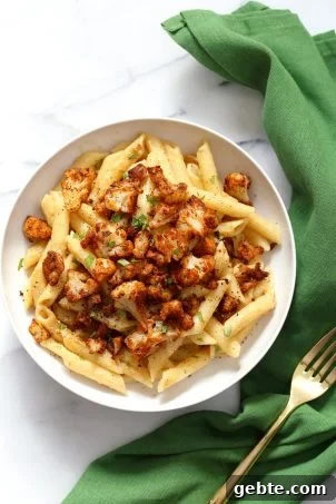 Vegan Garlic Pasta with Roasted Cajun Cauliflower. Cauliflower is tossed in homemade cajun spice blend and baked, then served over easy creamy Garlic sauce Penne Pasta. Vegan Recipe. Can be Nut-free gluten-free | VeganRicha.com