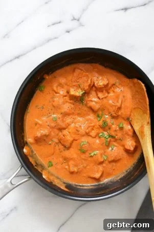 Restaurant Style Tofu Butter Masala Recipe - Indian Butter Tofu "Paneer". Dairy-free Tofu Paneer Butter Masala. Tofu is marinated and baked then simmered in tomato ginger cashew sauce. Vegan Gluten-free Recipe. | VeganRicha.com