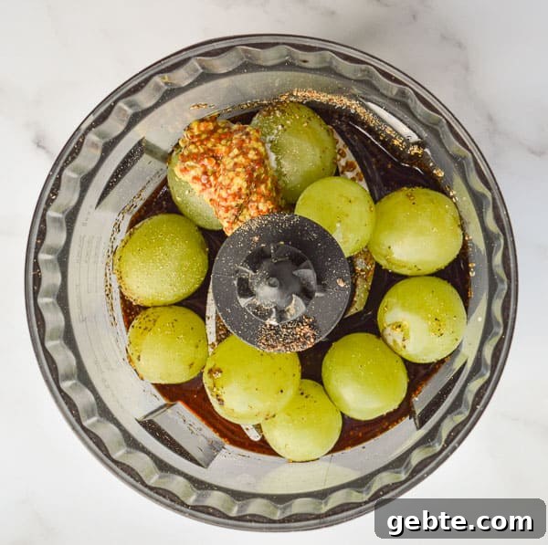 Grapes and balsamic vinegar in a food processor bowl