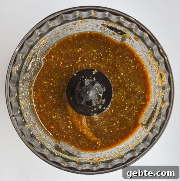 Blended balsamic salad dressing in a  food processor bowl
