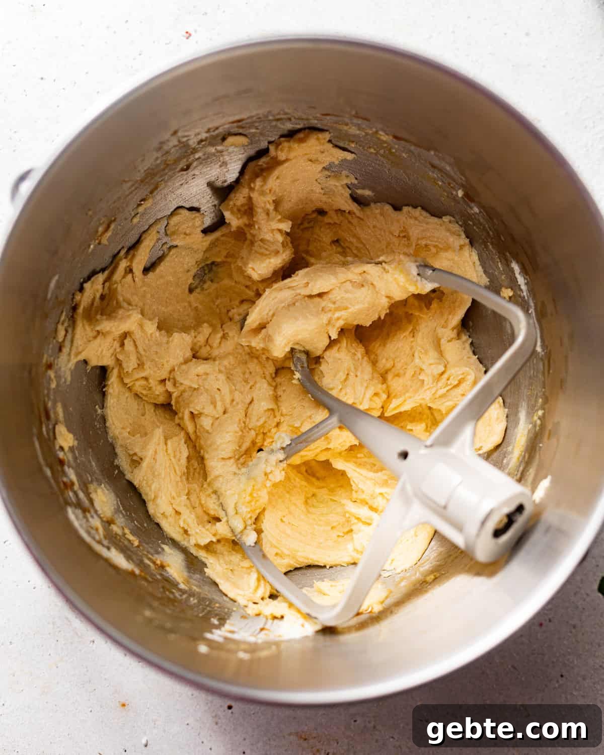 Crunchy Peppermint Chocolate Chip Cookies Recipe 5 butter, sugar, vanilla extract, egg, egg yolk, and peppermint extract mixed together in the bowl of a stand mixer.