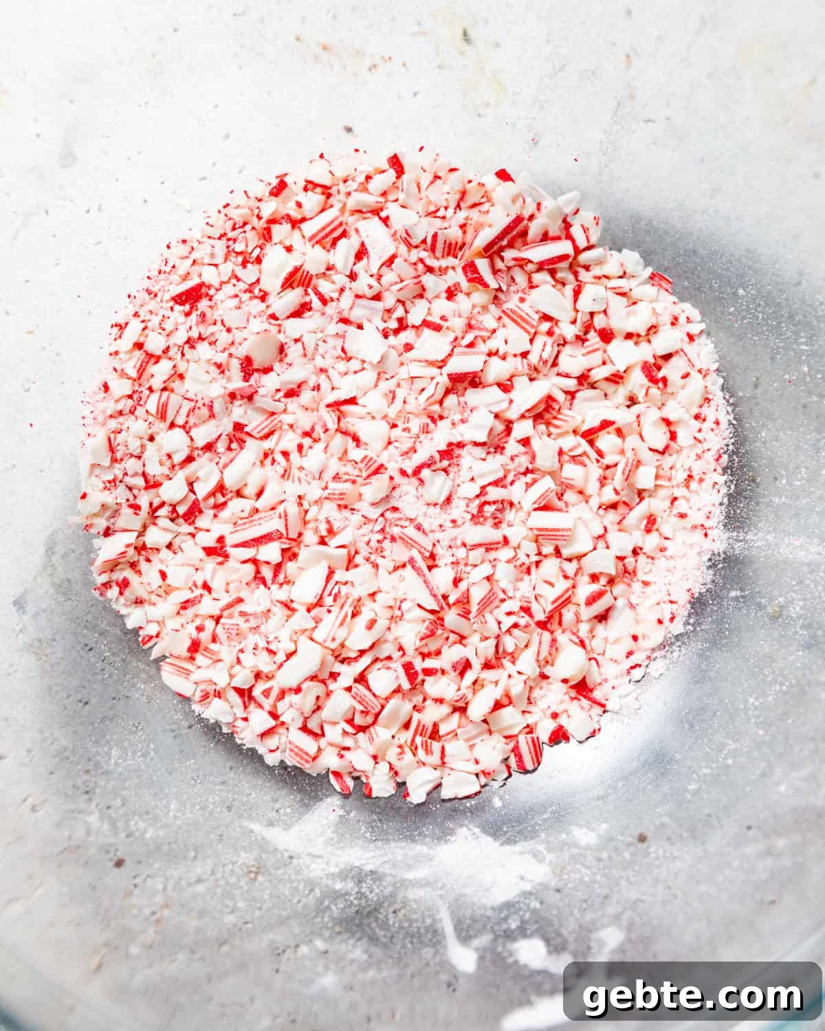 Crunchy Peppermint Chocolate Chip Cookies Recipe 10 crushed peppermint candies in a bowl.