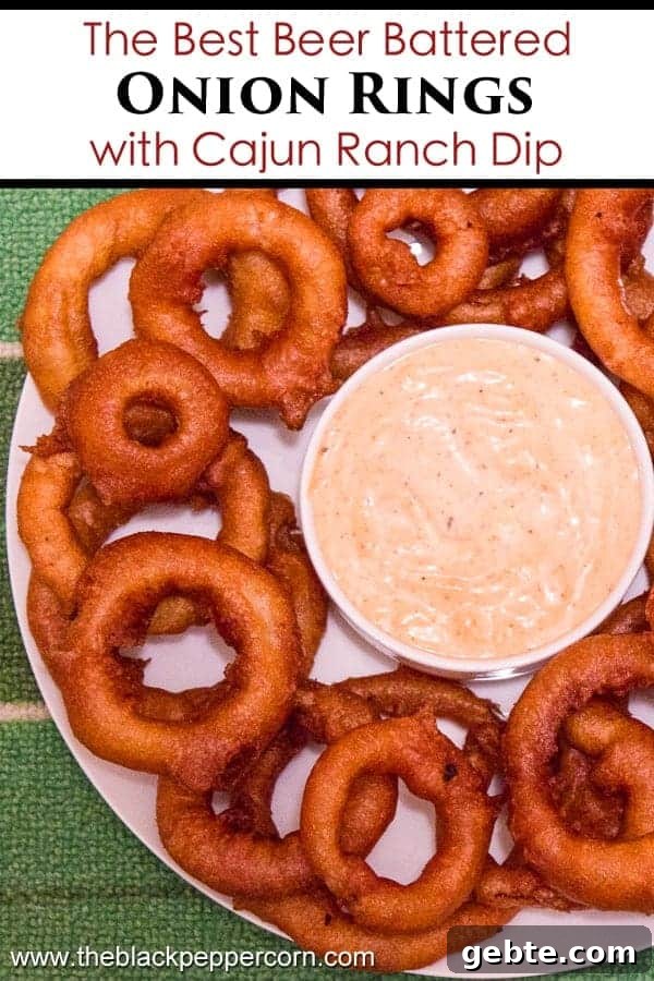 Light and crispy onion rings recipe that are deep fried in a beer batter coating with a cajun dip similar to the kind from Outback Steakhouses Bloomin' Onion.