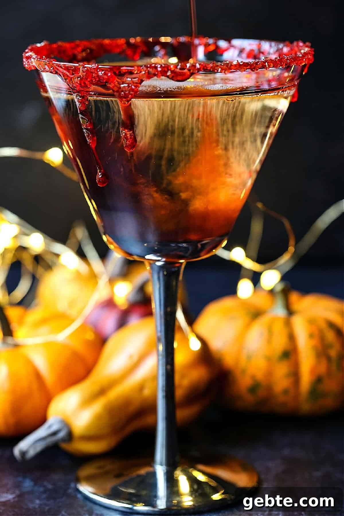 chambord being poured into martini glass with fake blood