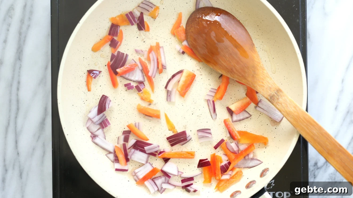 Veggies for Vegan Omelet on a white skillet
