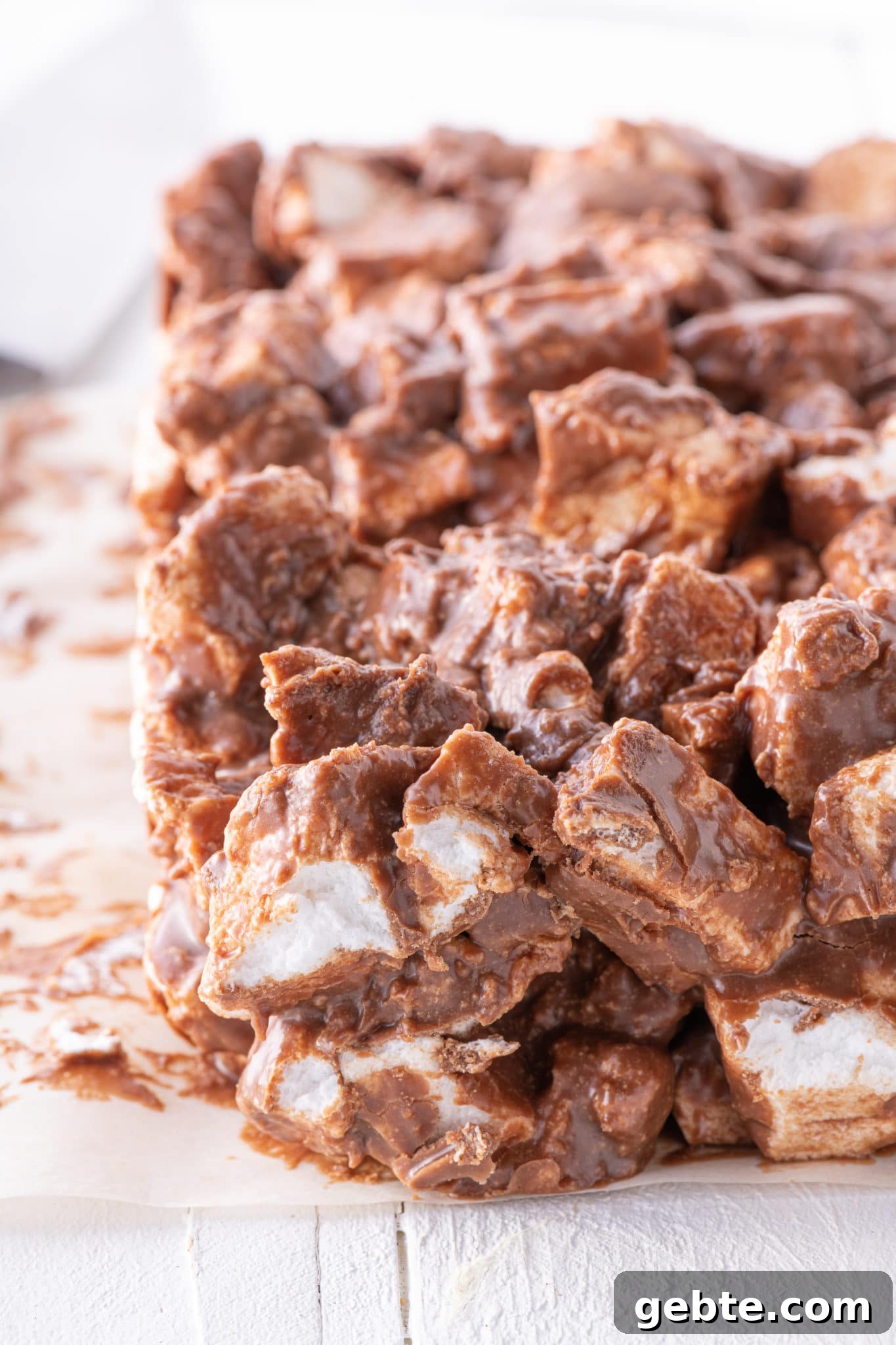 A slab of chocolate peanut butter sugar-free marshmallow bars on parchment 