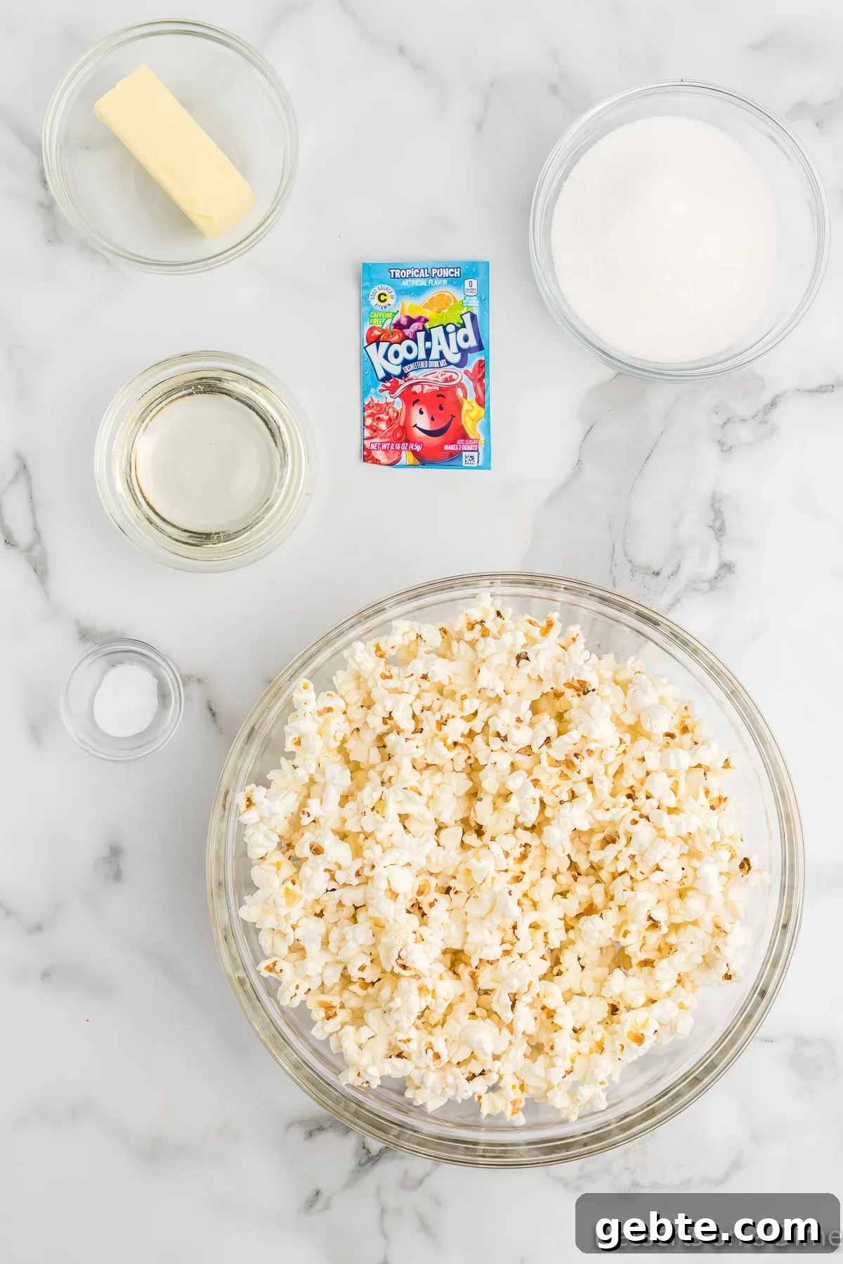 Ingredients for Koolaid popcorn  - popcorn, sugar, corn syrup, butter, kool-aid, baking soda. 