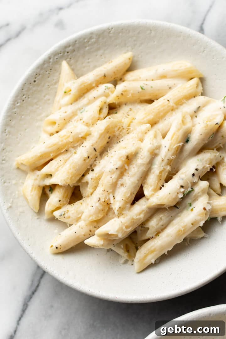 easy creamy penne pasta in a white bowl