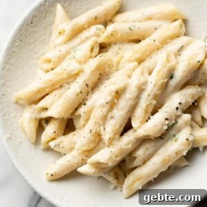 easy creamy penne pasta in a white bowl