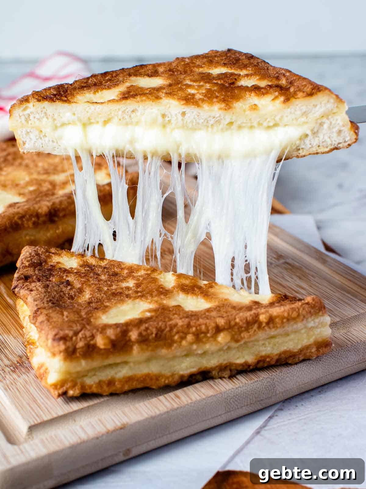 Crispy Mozzarella in Carrozza Sandwiches: Classic Italian Fried Cheese 2 Mozzarella in carrozza cut in half and showing cheese pull.