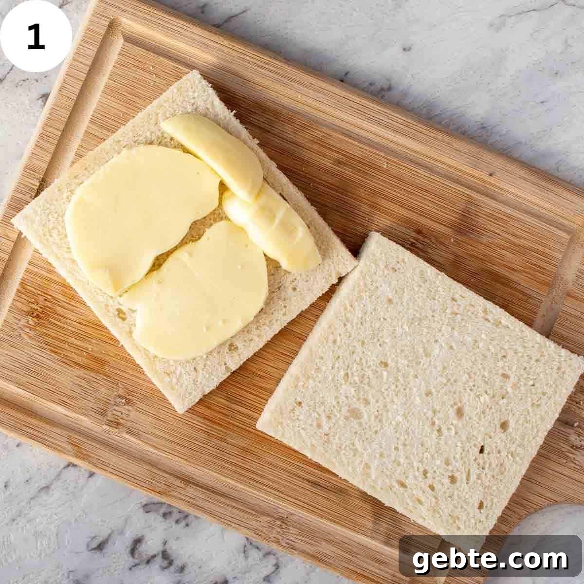Crispy Mozzarella in Carrozza Sandwiches: Classic Italian Fried Cheese 4 Two slices of crustless white bread, one topped with mozzarella slices.