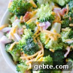 A fresh crisp broccoli salad tossed with a simple tangy homemade dressing. Broccoli salad is a quick salad everyone loves for any gathering, potluck, party, etc.