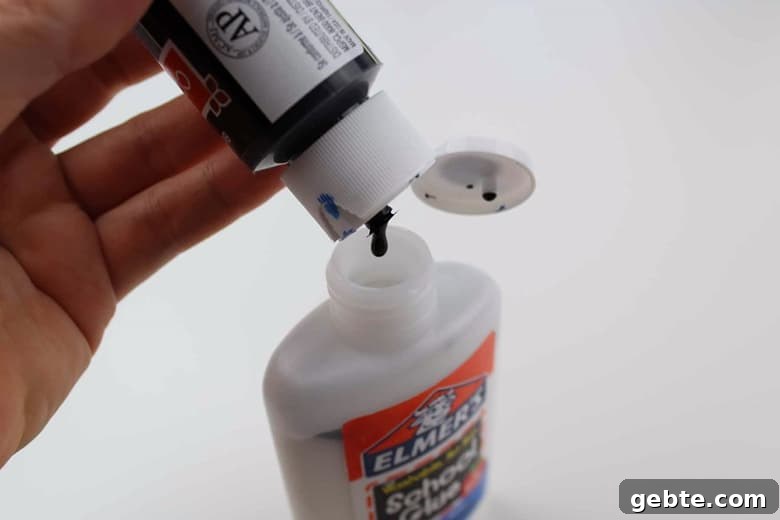 Pour black paint into white glue