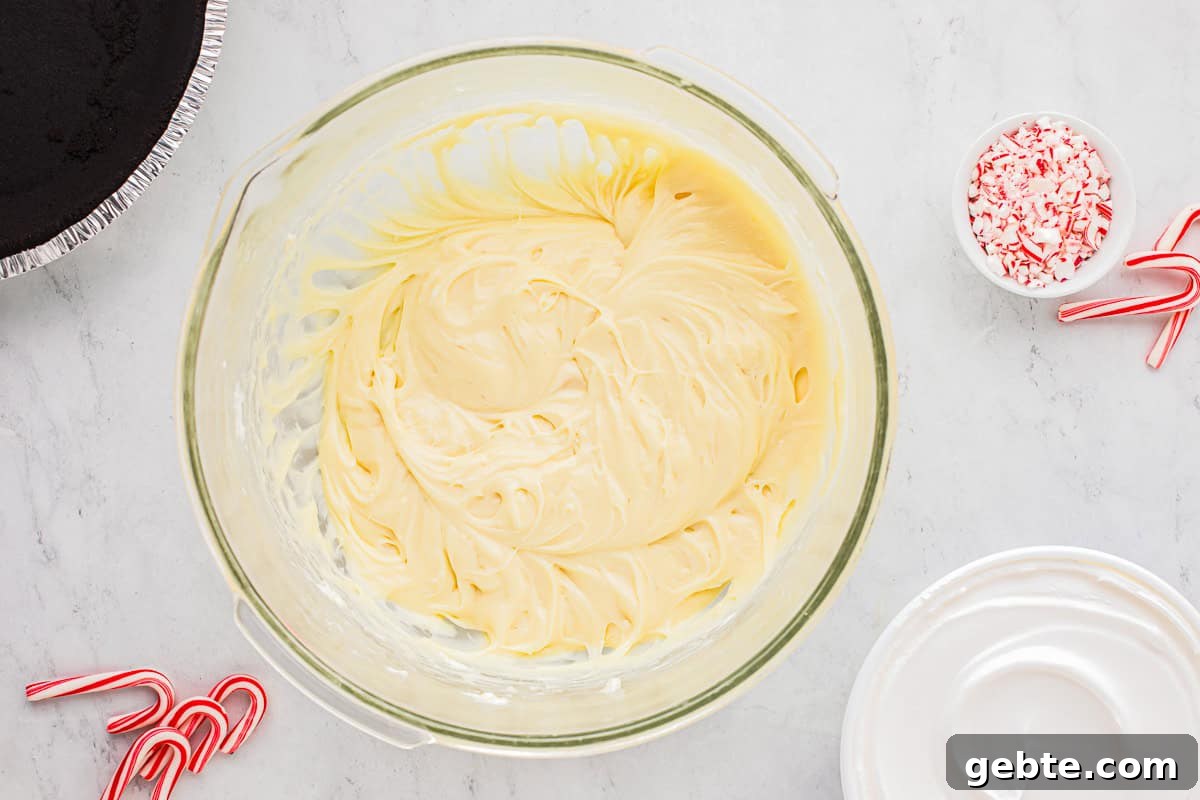 Classic Peppermint Pie Recipe — Cool Mint Dessert Guide 6 whipped white chocolate cream cheese filling in a glass bowl.