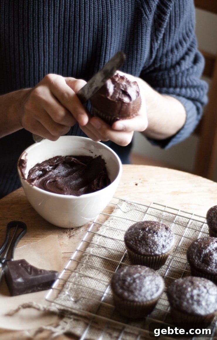 Frosting a cupcake