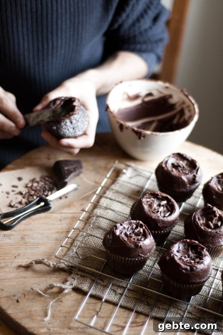 Decorating and frosting a cupcake with chocolate buttercream frosting
