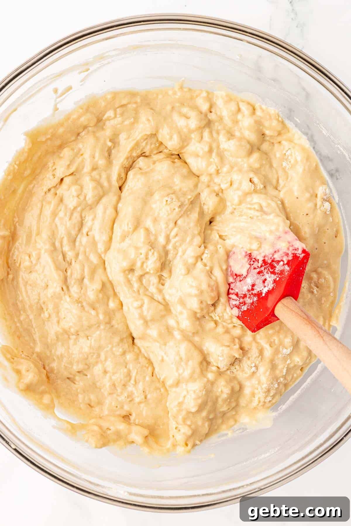 Moist Greek Yogurt Snack Cake with Lemon Glaze 12 mixing the wet and dry ingredients together