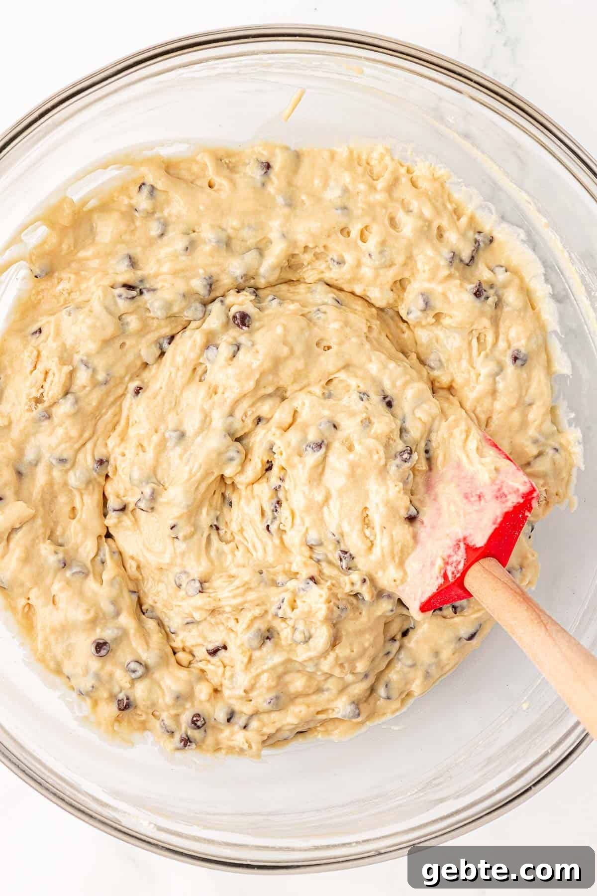 Moist Greek Yogurt Snack Cake with Lemon Glaze 14 folding the chocolate chips into the batter