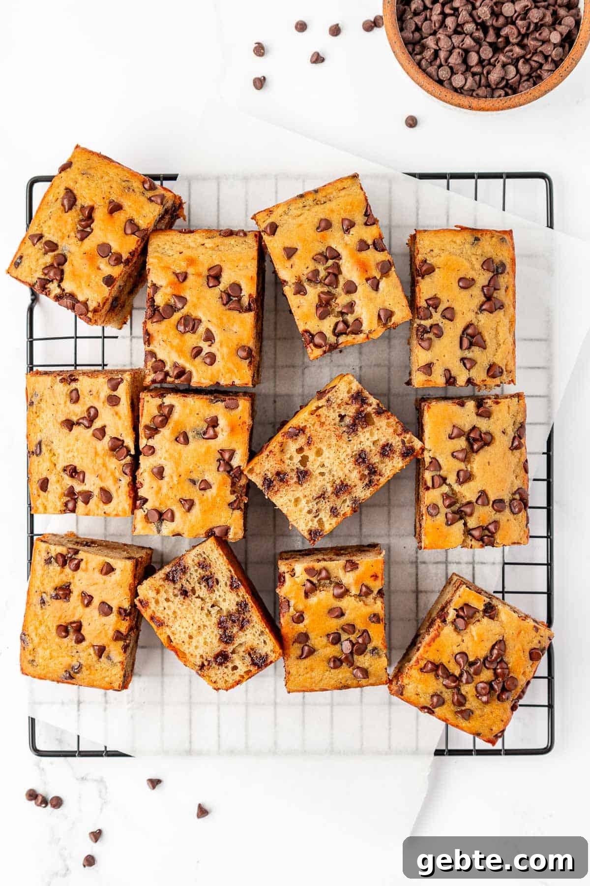 Moist Greek Yogurt Snack Cake with Lemon Glaze 19 greek yogurt snack cake squares on a cooling rack