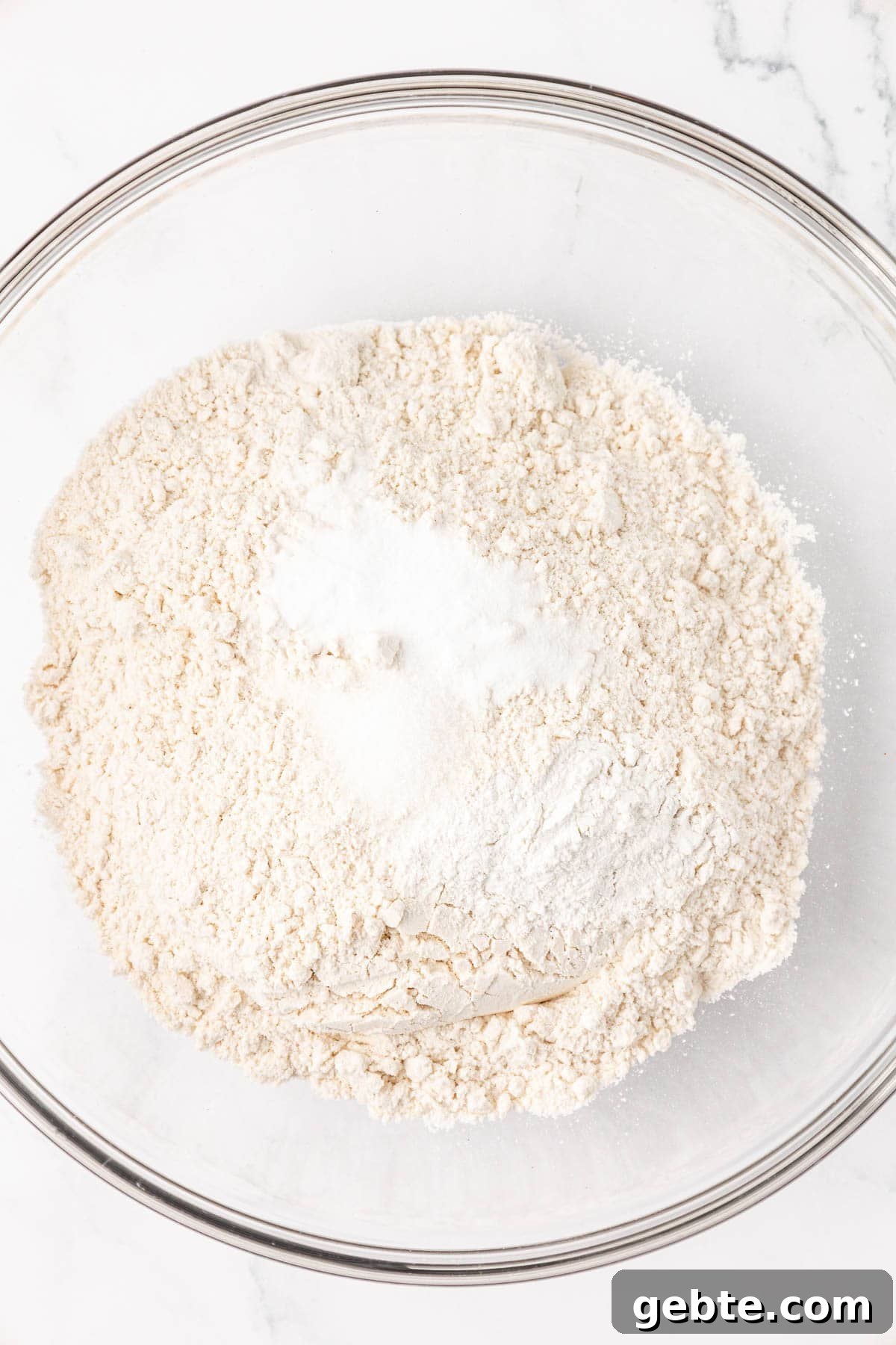 Moist Greek Yogurt Snack Cake with Lemon Glaze 5 dry ingredients in a mixing bowl