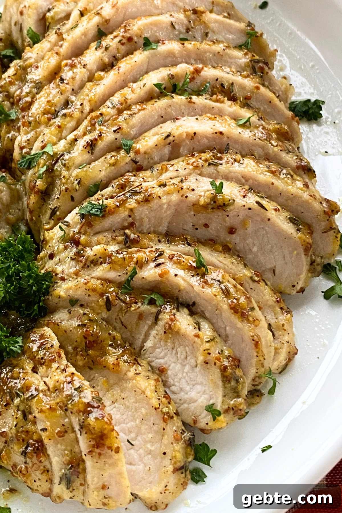 Platter of marinated sliced turkey breast tenderloin with maple dijon mustard garlic crust.