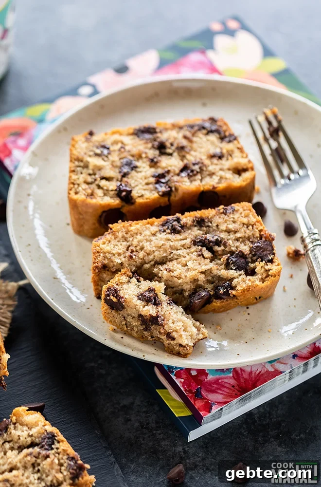 two slices of eggless chocolate chip cake served on a white plate with a fork